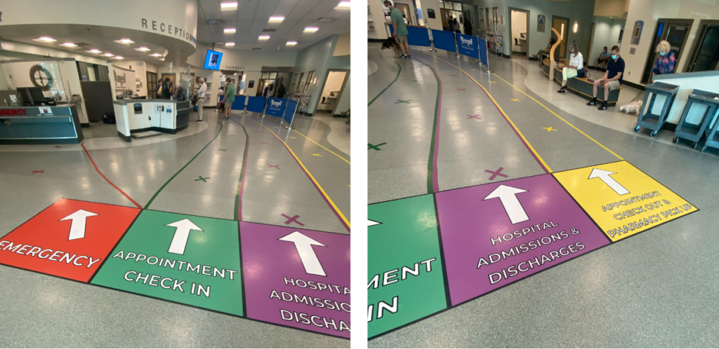 An image of floor signage at a veterinary hospital.