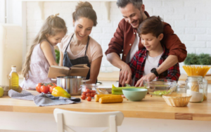 a family prepares a meal together.